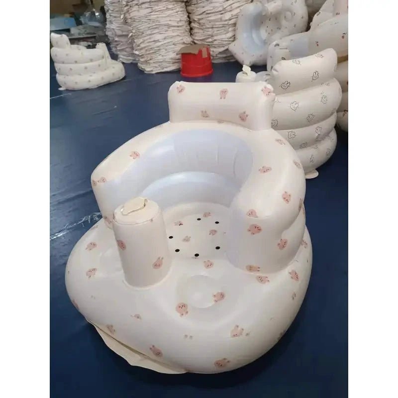 Inflatable baby chair by MANDOTOS designed for dining and bath, with soft, colorful inflatable cushions for comfortable seating.