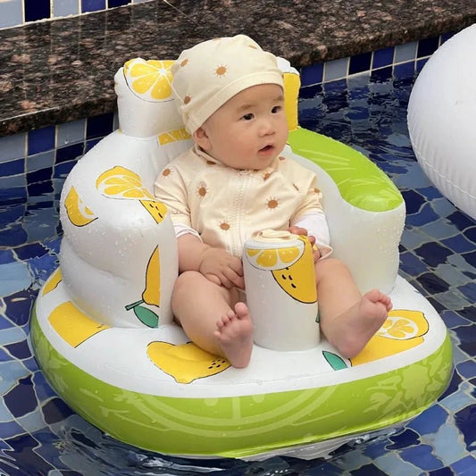 Inflatable baby chair by MANDOTOS for dining and bath, featuring a soft, colorful design with secure seating for infants.