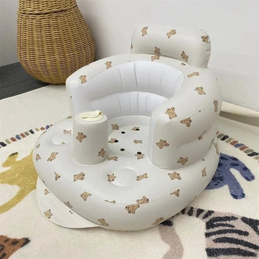 Inflatable baby chair for dining and bath by MANDOTOS, featuring a soft, colorful design with a secure seat for infants.