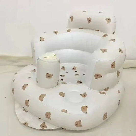 Inflatable baby chair by MANDOTOS designed for dining and bath, with soft, durable material and a secure, supportive seat for infants.