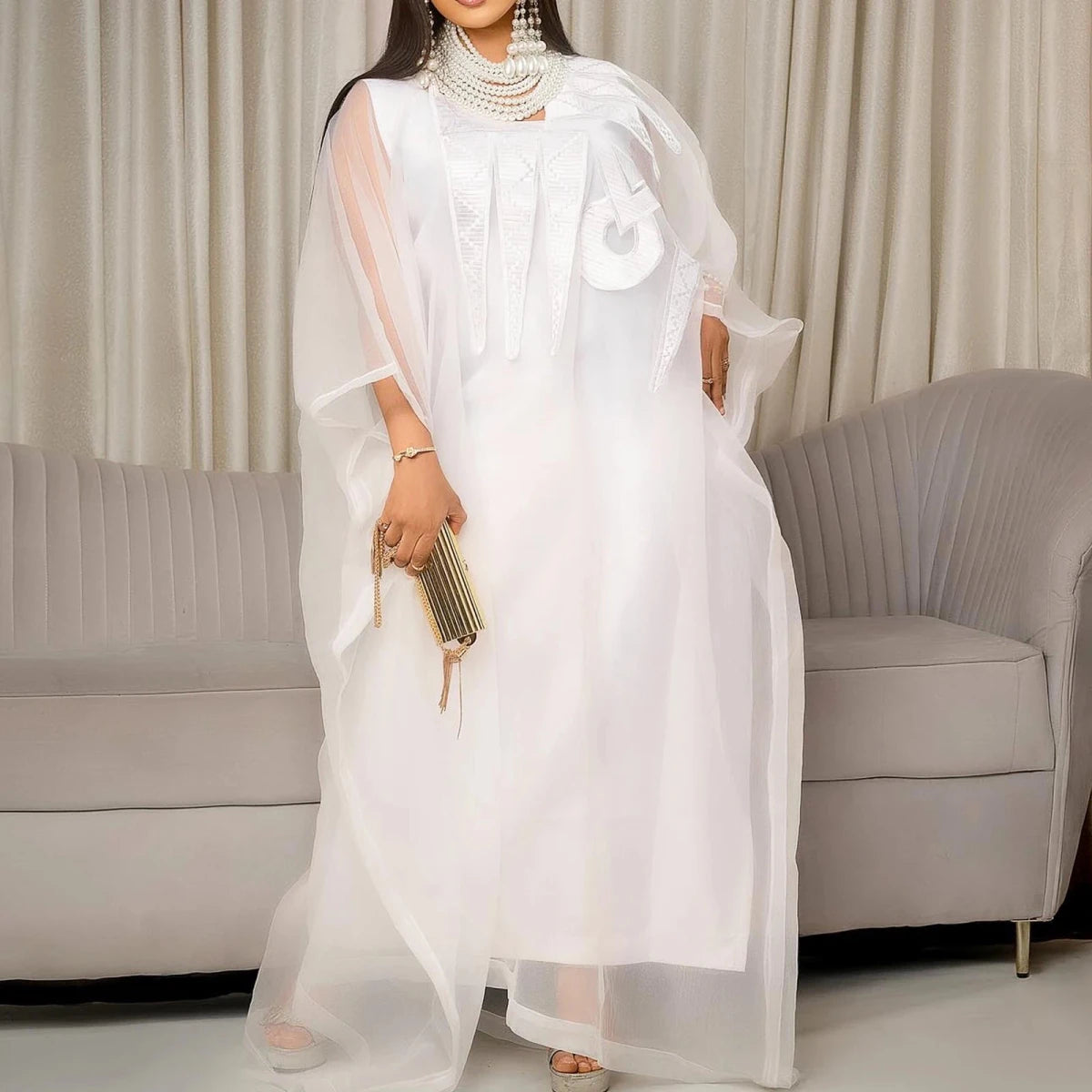 Elegant white African abaya dress for women with embroidery, plus size, suitable for parties or church events, by MANDOTOS INTERNATIONAL.