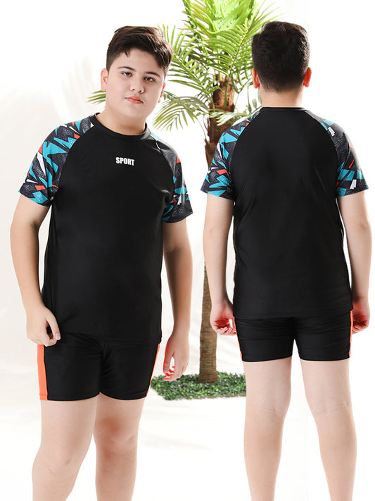 Mandotos International boys' swim trunks from 2026, two-piece youth swimwear with colorful design, suitable for older children.