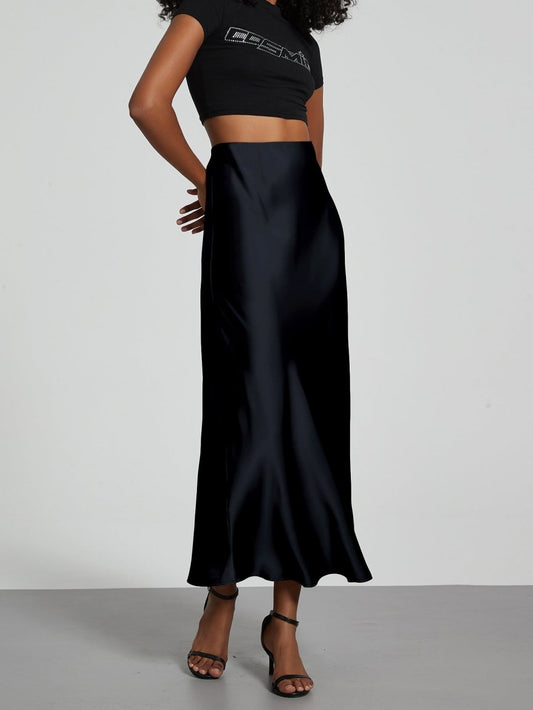 European American style satin midi skirt by MANDOTOS INTERNATIONAL, featuring a smooth fabric and elegant midi length.