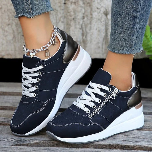 Fashionable lace-up sneakers with zipper detail and medium heel height by MANDOTOS INTERNATIONAL, showcasing stylish footwear design
