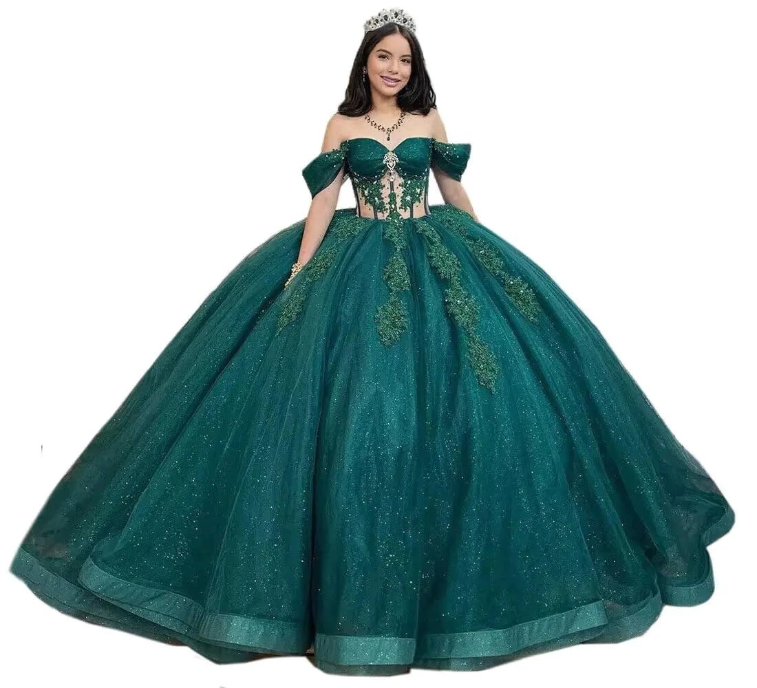 Dark green Glitz Sparkle Quinceanera gown by MANDOTOS INTERNATIONAL with shimmering embellishments and elegant flowing fabric.