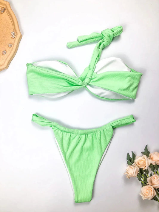 Eco-friendly women's one-shoulder bikini set by MANDOTOS INTERNATIONAL, featuring a sexy split design in recycled fabric.