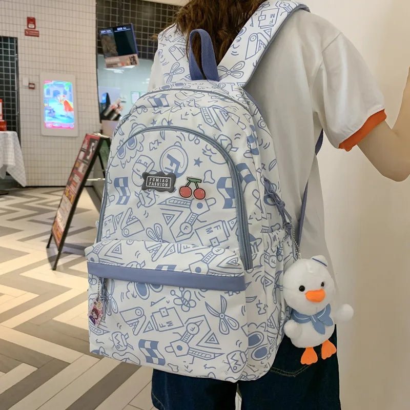 High capacity plaid backpack by MANDOTOS INTERNATIONAL with cute print, ideal for students and school use.