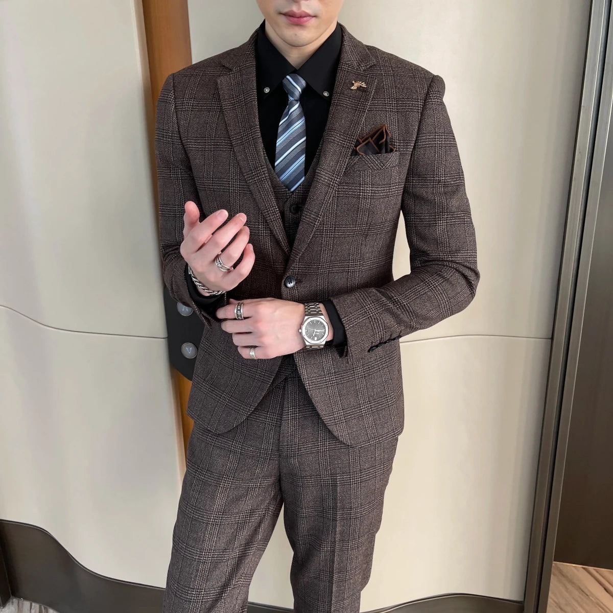 British Korean style plaid men's 3-piece business casual suit set by MANDOTOS INTERNATIONAL, featuring a tailored blazer, vest, and trousers.
