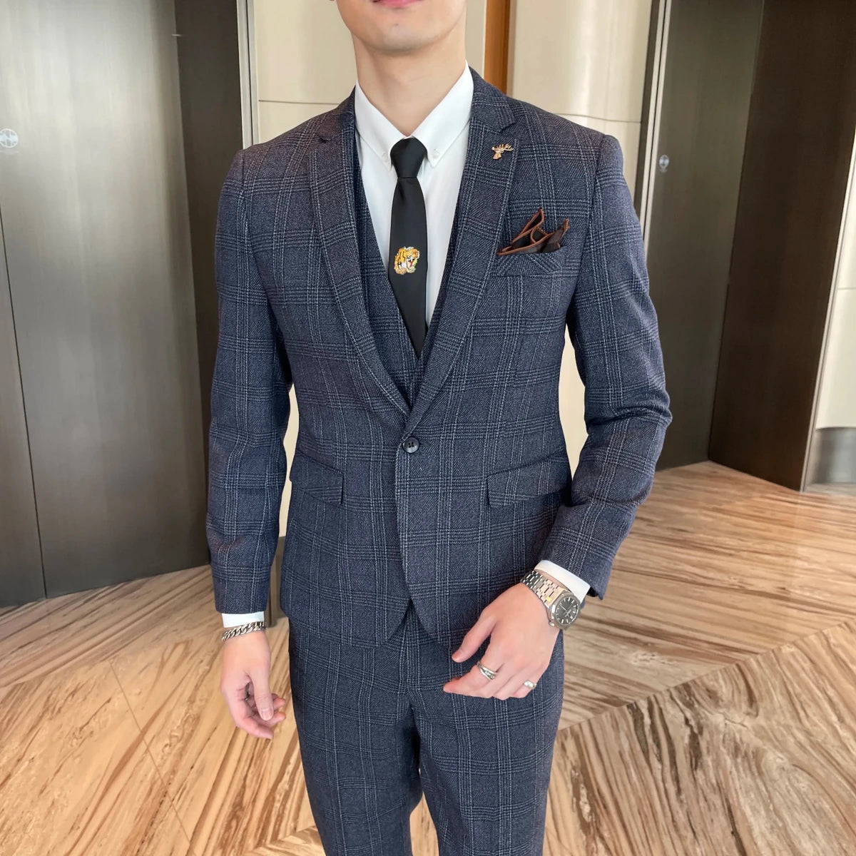 British Korean style plaid men's 3-piece business casual suit set by MANDOTOS INTERNATIONAL, featuring a tailored blazer, vest, and pants.
