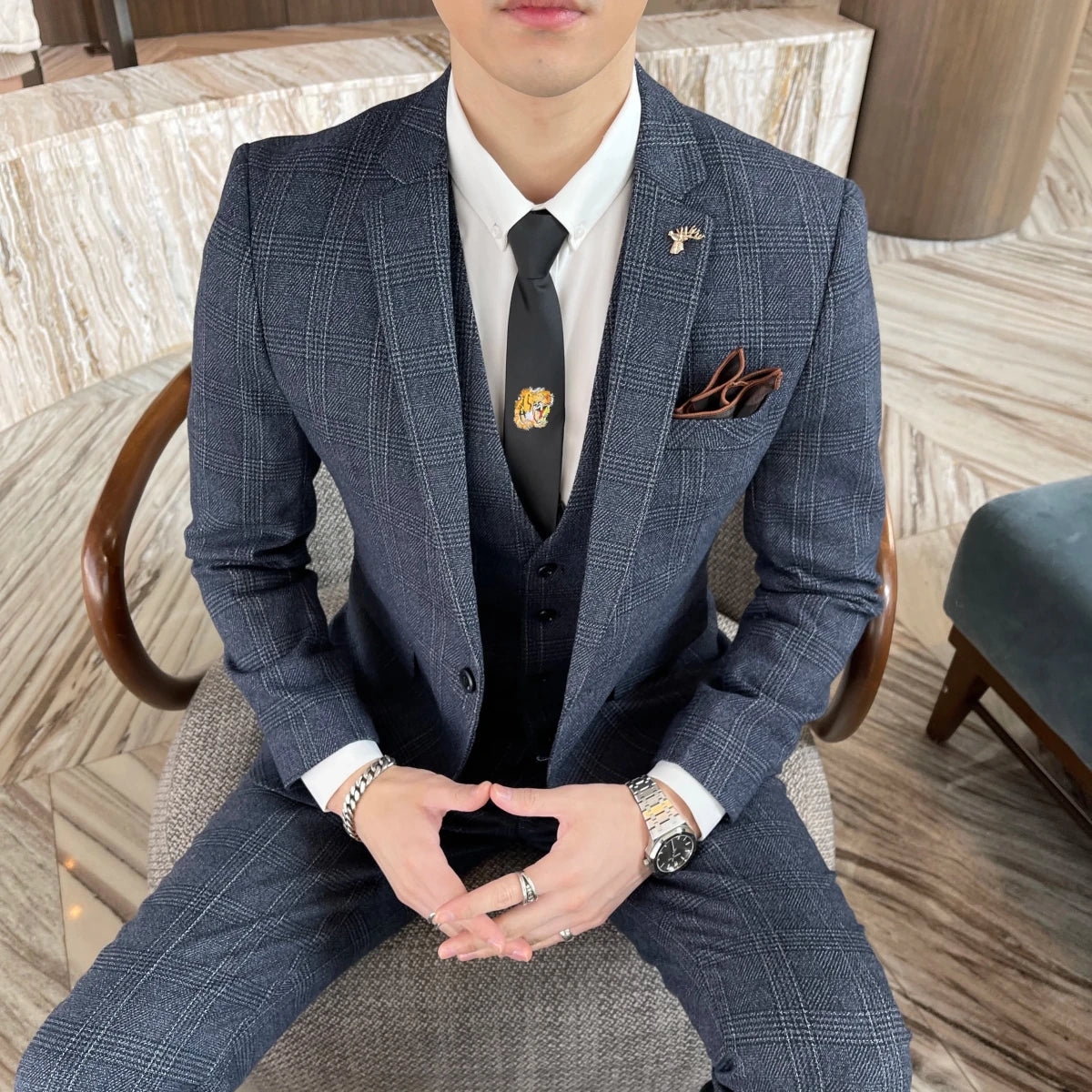 British Korean style plaid men's 3-piece business casual suit set by MANDOTOS INTERNATIONAL, featuring a blazer, vest, and trousers.