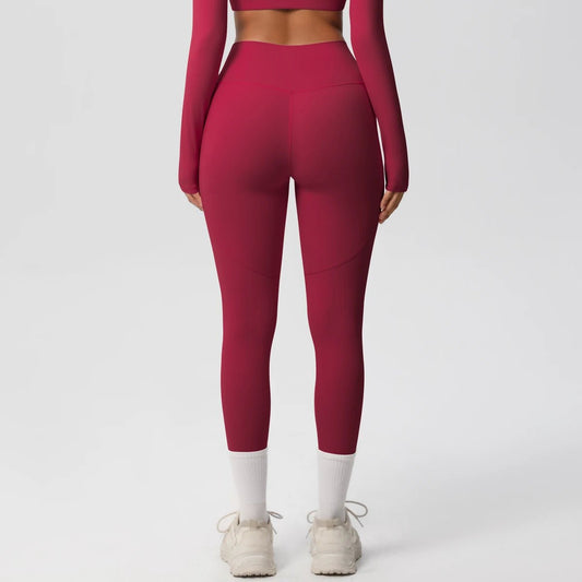 High waist women's stretch yoga leggings with pockets, push-up fit, solid color fitness pants for running and workout activities.