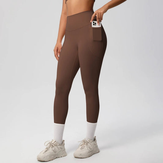 High waist women's Mandotos International yoga leggings with stretch fabric, pockets, and a push-up design for fitness and running.