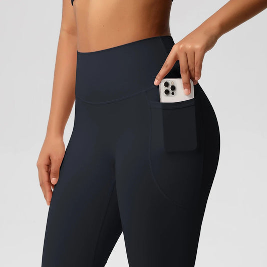 Mandotos International high waist women's leggings with pockets, stretch yoga pants for fitness, running, and sports in solid color.