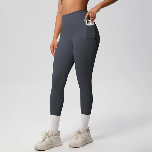 High waist women's Mandotos International yoga leggings with pockets, stretch fabric, push-up design, ideal for fitness and running.