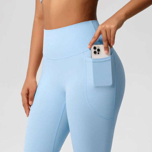 High waist women's Mandotos International leggings with stretch fabric, pockets, and push-up design for yoga, running, and fitness activities.
