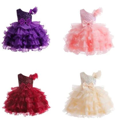 Kids glam dresses and gowns by MANDOTOS INTERNATIONAL, featuring vibrant colors and elegant designs for special occasions.