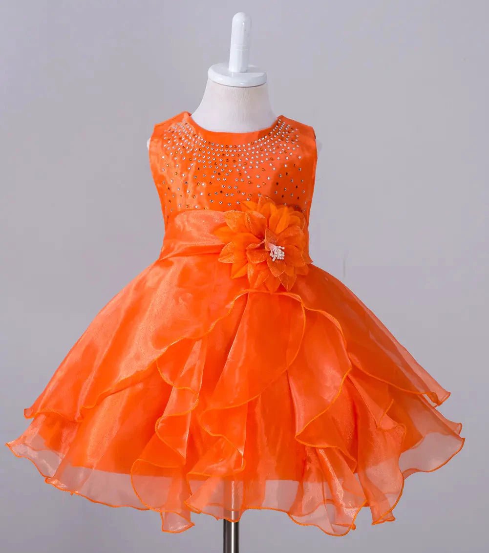 Kids glam dresses and gowns by MANDOTOS INTERNATIONAL, featuring colorful, sparkly designs for special occasions.