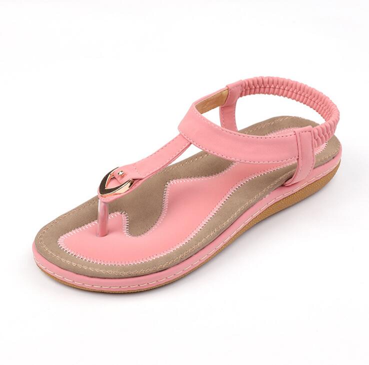 Ladies' chic beach flip flops by MANDOTOS INTERNATIONAL with stylish straps and comfortable soles, perfect for summer outings.