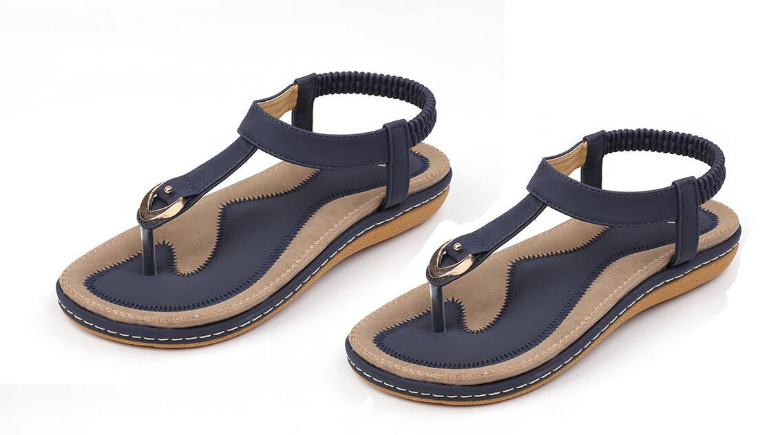 Ladies' chic beach flip flops by Mandotos International with stylish straps and comfortable soles for warm weather.