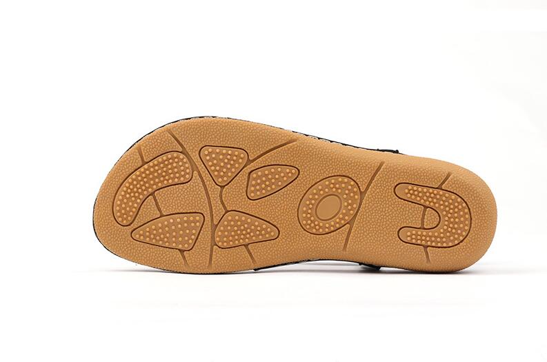 Ladies' chic beach flip flops from MANDOTOS INTERNATIONAL with stylish straps and comfortable sole, perfect for summer outings.