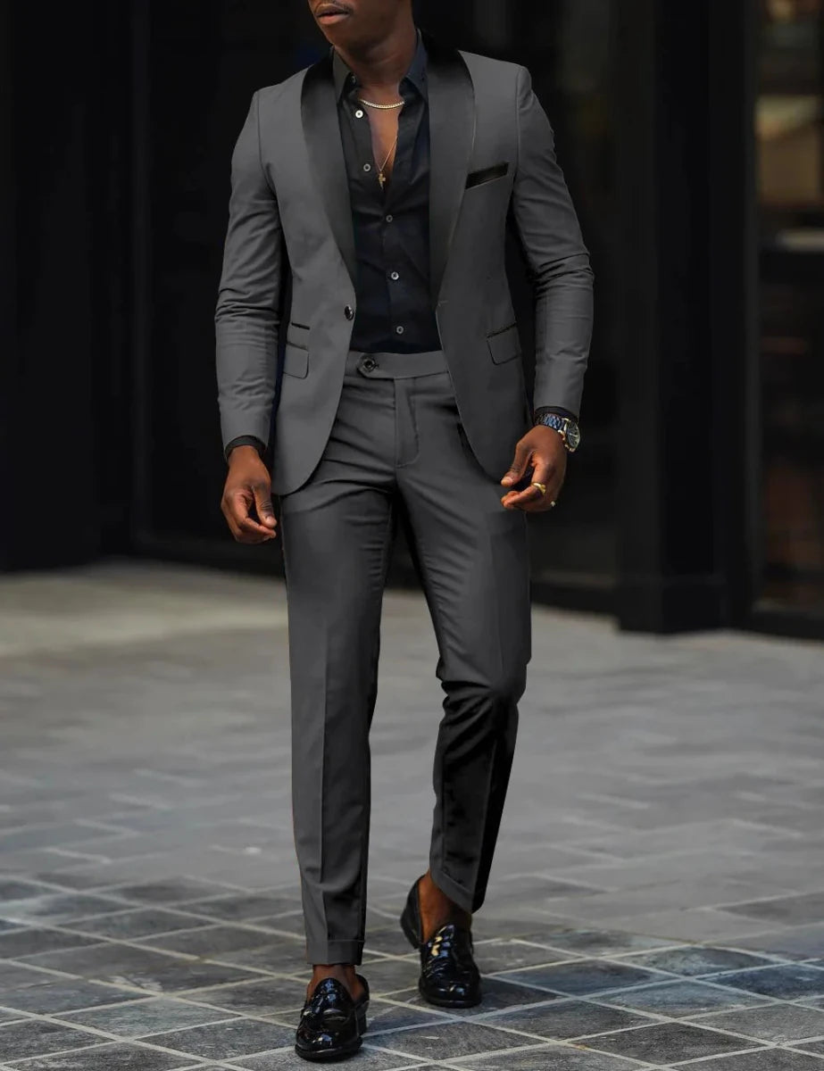 Men's slim-fit business casual suit jacket and trousers by MANDOTOS INTERNATIONAL, shown on a model.