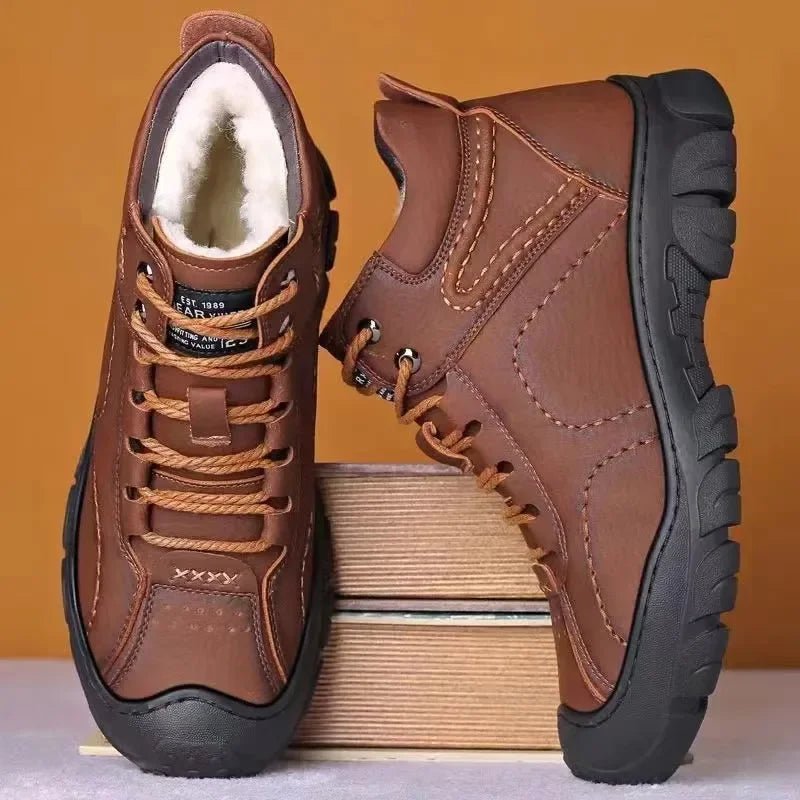 Men's waterproof winter ankle boots by MANDOTOS INTERNATIONAL featuring non-slip soles and durable work shoe design.
