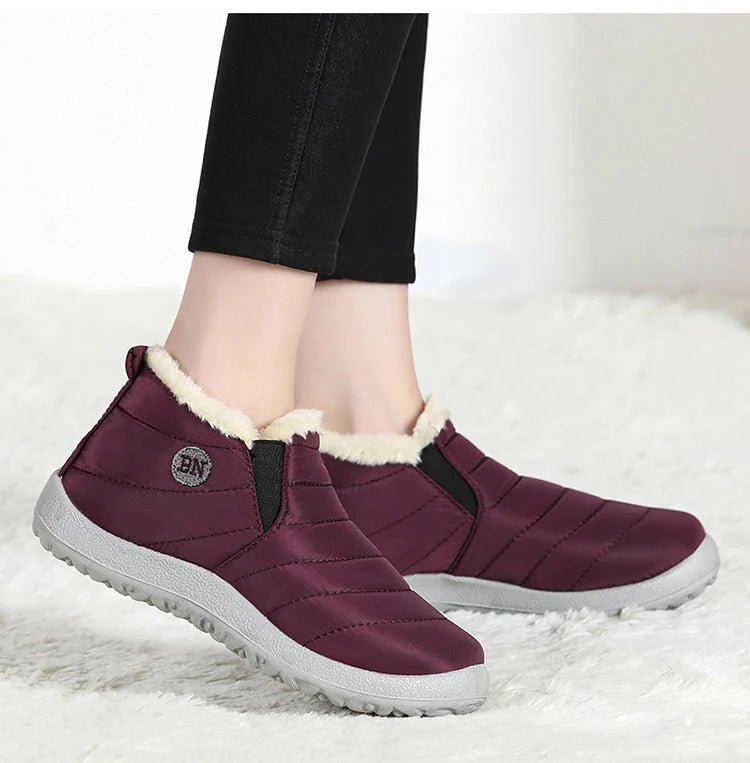 Men's waterproof winter snow boots by MANDOTOS INTERNATIONAL, outdoor work shoes with plus size fit and rugged traction.