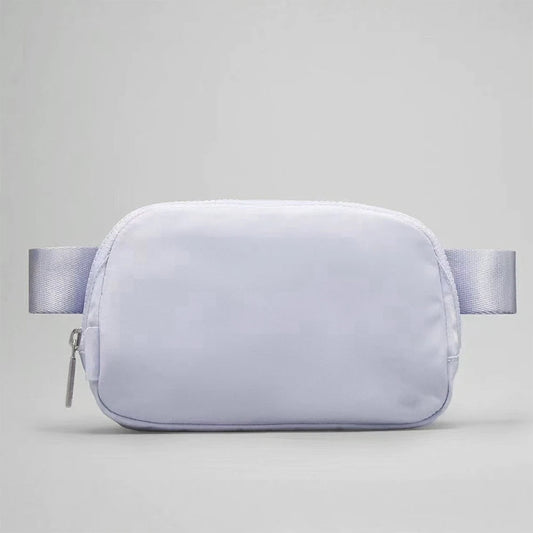 Mandotos International lightweight women’s waist bag for running and travel, with adjustable strap and secure zipper closure.