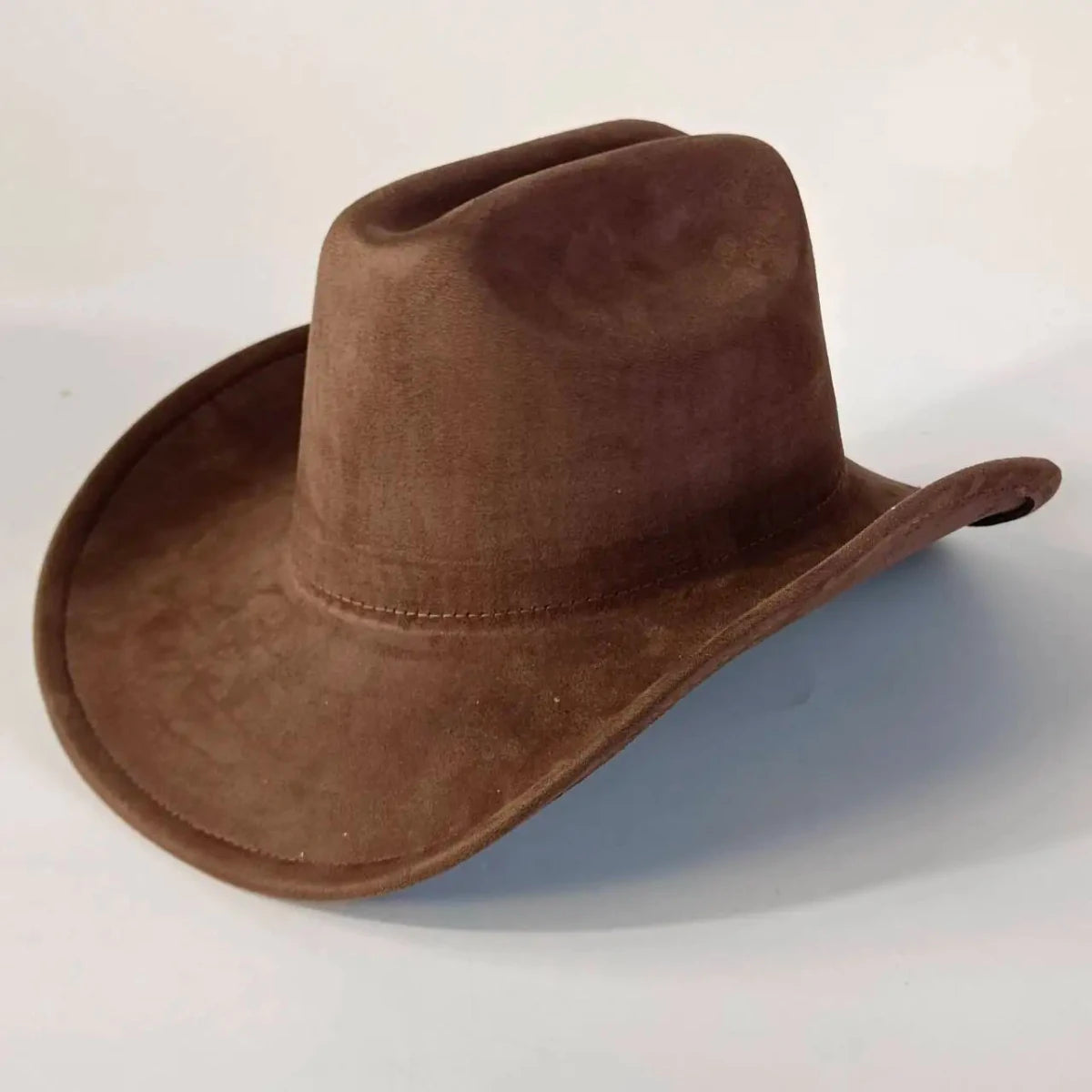 Premium suede cowboy hat by MANDOTOS INTERNATIONAL, stylish unisex outdoor hat with wide brim and classic cowboy design.