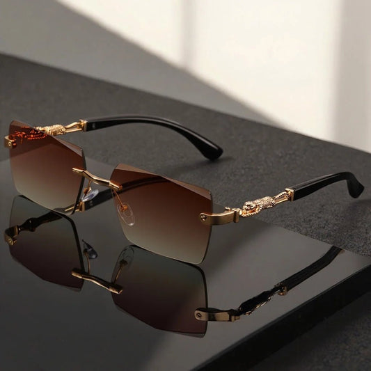Unisex luxury frameless black and gold sunglasses with leopard print, UV400 protection, thin rectangular lenses, elegant design.