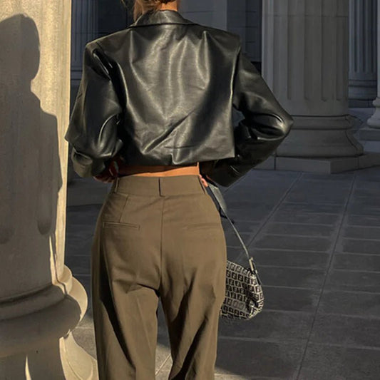 Mandotos International Vogue PU cropped jacket featuring a stylish design and fitted silhouette on a plain background.
