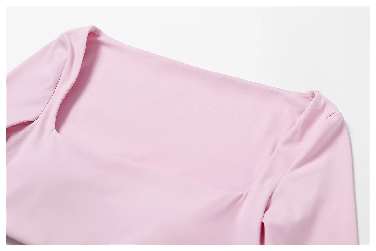 Women's long sleeve fitness T-shirt by MANDOTOS INTERNATIONAL, gym-ready push-up top with a comfortable fit and stylish design.