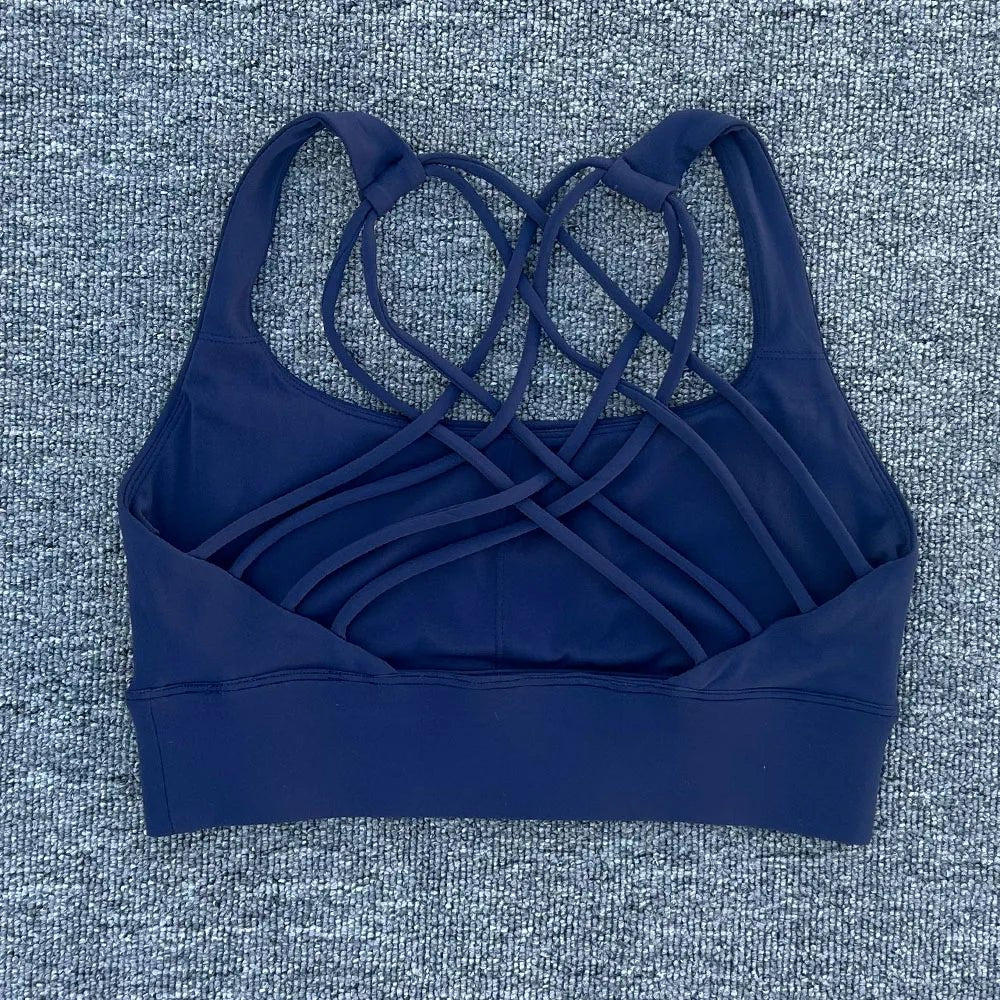 Women's shockproof yoga crop top by MANDOTOS INTERNATIONAL, anti-sweat gym sports bra with breathable fabric and supportive fit.