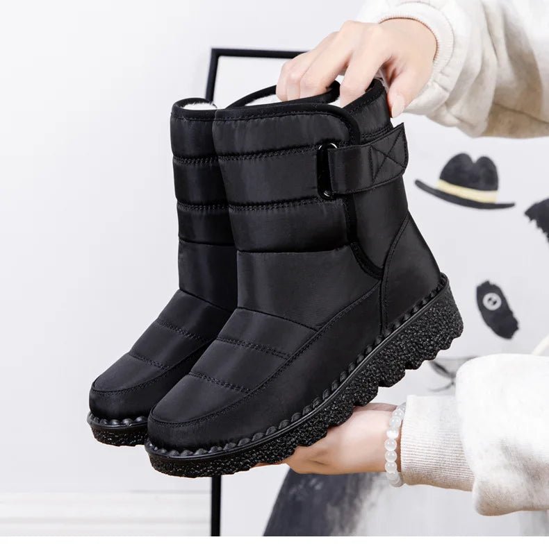Women's waterproof winter snow boots by MANDOTOS INTERNATIONAL with non-slip soles, warm lining, and platform design.
