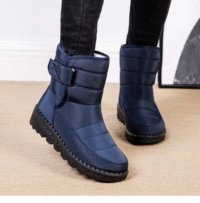 Women's waterproof winter snow boots by MANDOTOS INTERNATIONAL featuring non-slip soles, warm lining, ankle height, and platform style.
