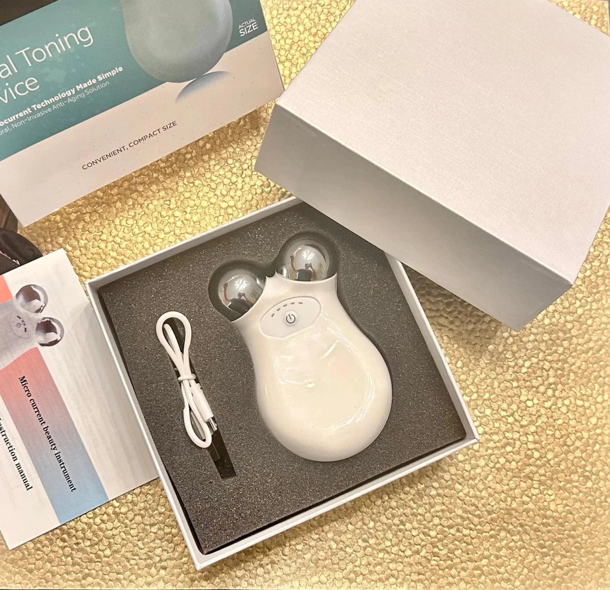 Mandotos International YouthBoost Microcurrent Facial Toner bottle, clear container with pump and label, on a white background.