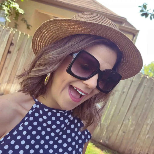 Mandotos Island Breeze Boater hat with wide brim and floral band, suitable for summer outdoor wear