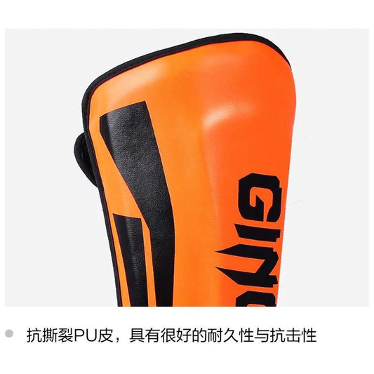 Mandotos kickboxing shin guards and Muay Thai leg protectors showing padded armor for martial arts training and combat sports.