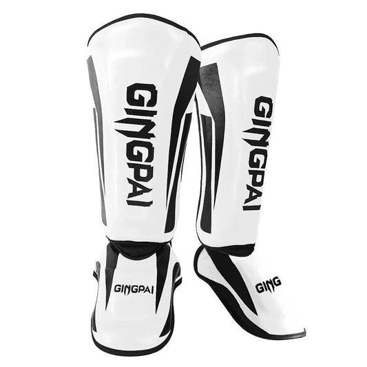 Mandotos kickboxing shin guards and Muay Thai leg protectors, padded for impact, designed for martial arts training and sparring.