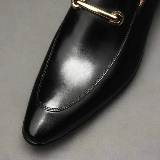 Men's leather loafers by MANDOTOS featuring classic slip-on design and sleek black finish.