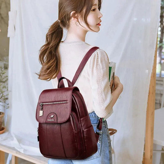 Luxury embossed leather backpack by MANDOTOS showing textured leather and stylish design with adjustable straps.