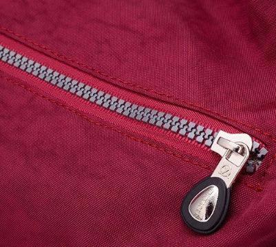 Mandotos luxury women's waterproof Bylon cloth crossbody bag with large capacity, shoulder strap, and tote style.