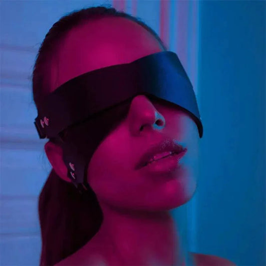 Luxury leather sleep mask by MANDOTOS, soft black leather with adjustable strap for comfortable, restful sleep.