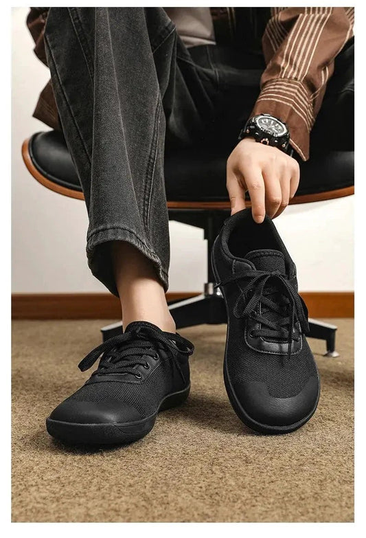 Mandotos men's breathable wide toe mesh running shoes with lightweight responsive sole for comfortable support.