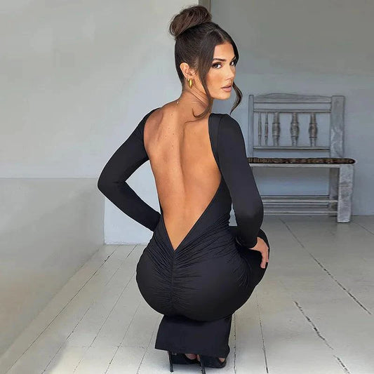 Mandotos Chic backless silk dress made from smooth milk silk, featuring a sleek, elegant design perfect for evening wear.