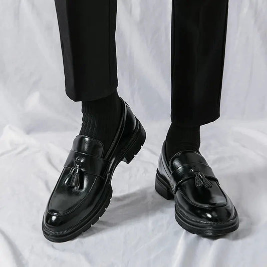 Men's elegant breathable tassel loafers by MANDOTOS, showing sleek leather design with tassel accents and comfortable slip-on style.