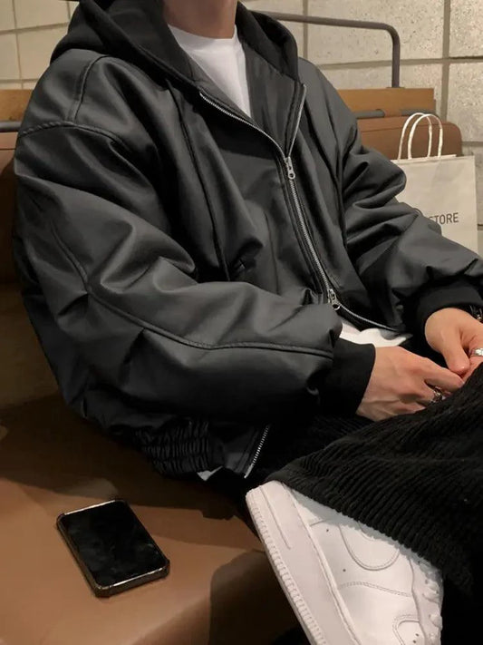 Men's hooded leather jacket by MANDOTOS, featuring a classic design with a hood, front zipper, and stylish black leather.