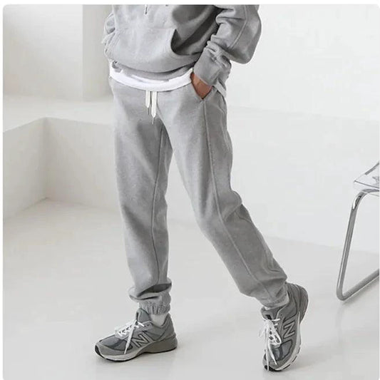 Men's hooded sports sweatshirt by MANDOTOS, featuring a comfortable fit, drawstring hood, and athletic style in a casual setting.