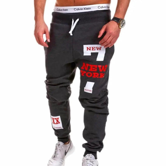 Mens black joggers by MANDOTOS, featuring a relaxed fit and elastic waistband, displayed on a neutral background.