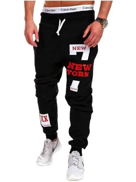 Mandotos men's joggers in black with elastic waistband and cuffed ankles, made from comfortable athletic fabric.